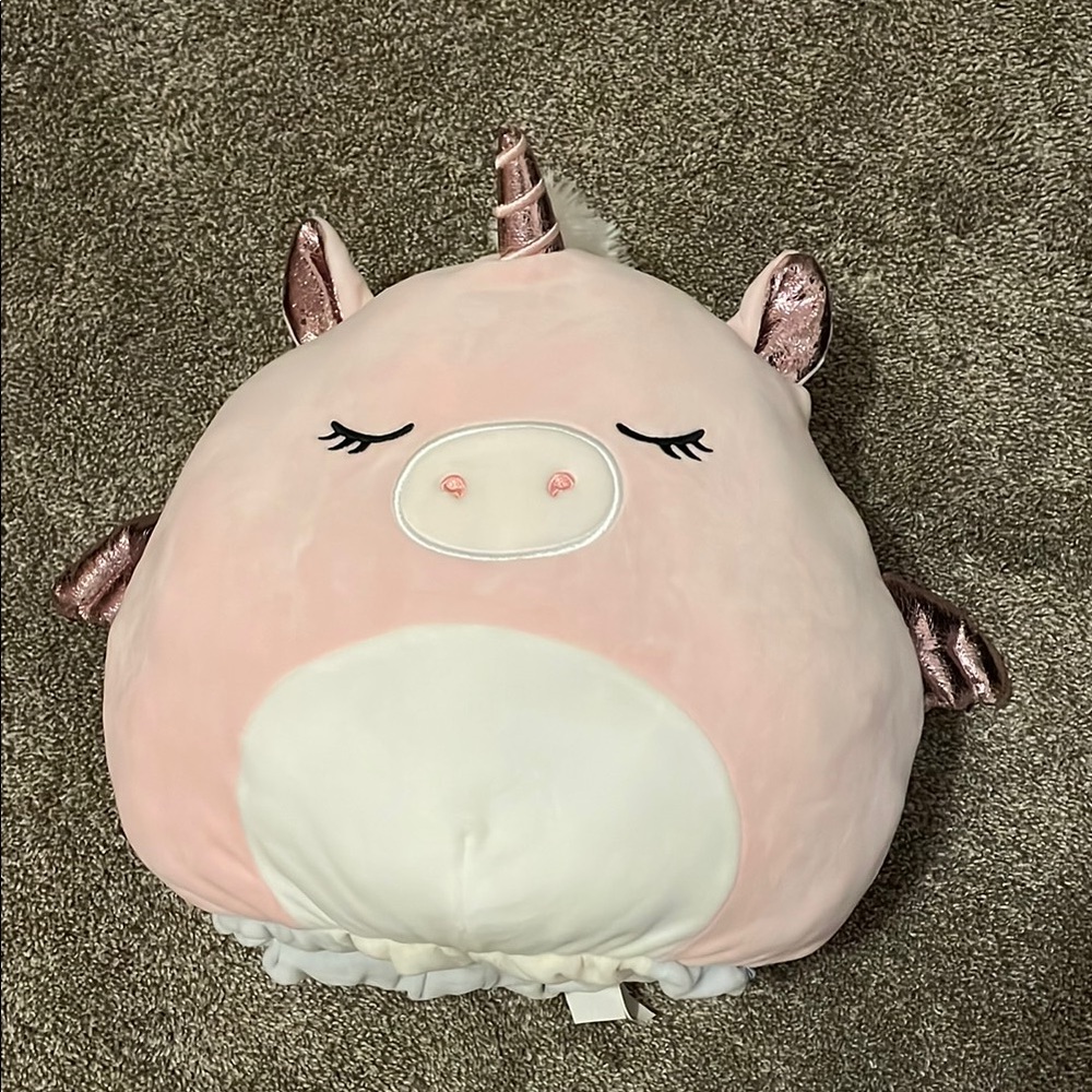Squishmallows Flipmallow light pink unicorn and light blue dragon.